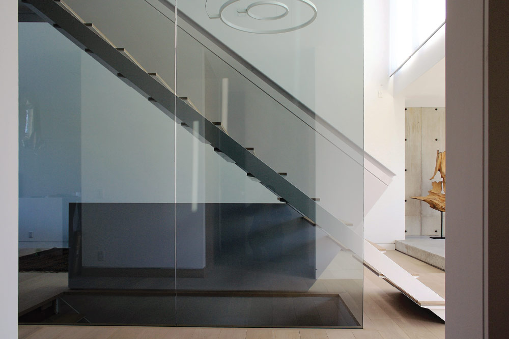side stringers / metal and wood steps / extra thin steps / floor to ceiling glass / solid guard