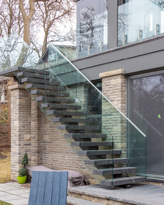 mono stringer / stone box steps / glass top mount handrails / rectangular aluminum handrails